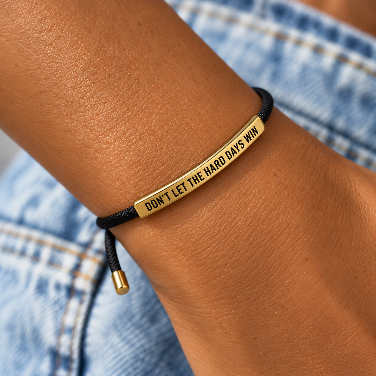 Don't Let The Hard Days Win armband, black cord with engraved gold bar