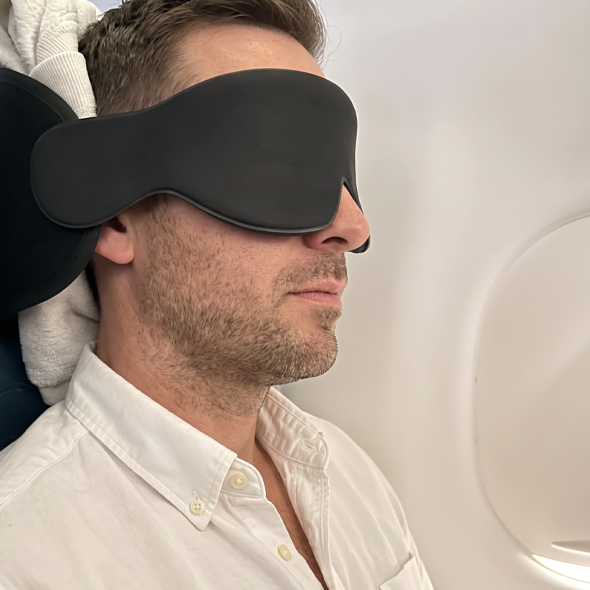 Traveler asleep wearing the mask
